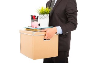 26538766 - fired businessman carrying his belongings
